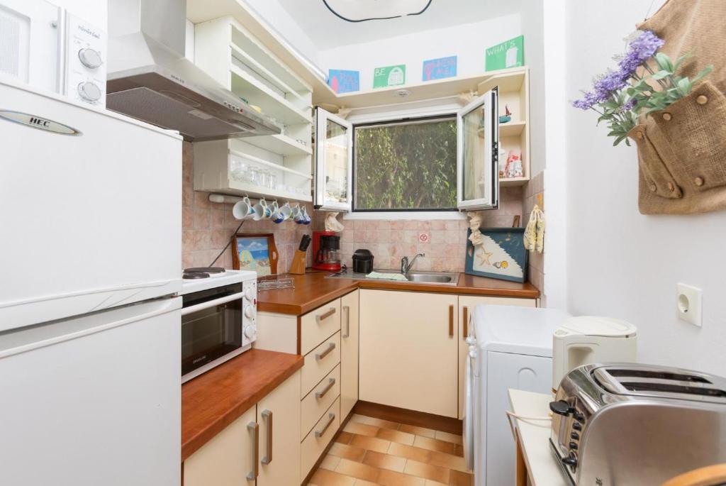 Kuchyň nebo kuchyňský kout v ubytování Effie Apartment
