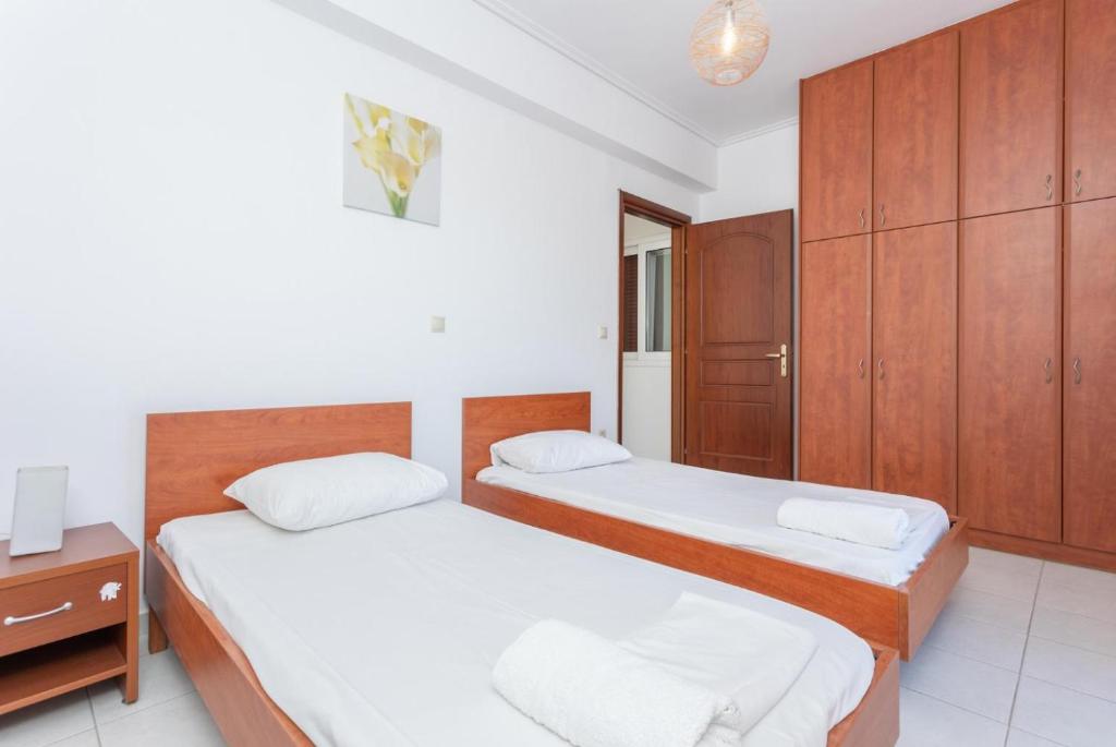 A bed or beds in a room at Villa Europe Thia