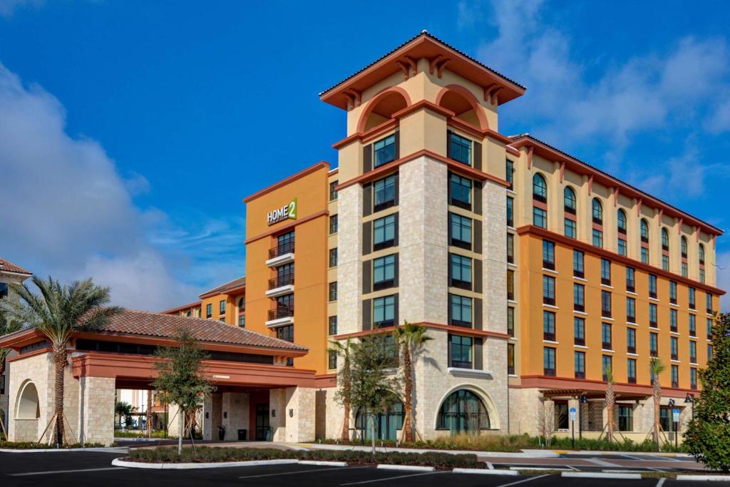 a rendering of the hotel exterior at Home2 Suites By Hilton Orlando Flamingo Crossings, FL in Orlando