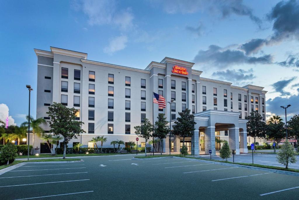 a rendering of a hotel with a parking lot at Hampton Inn & Suites Orlando International Drive North in Orlando