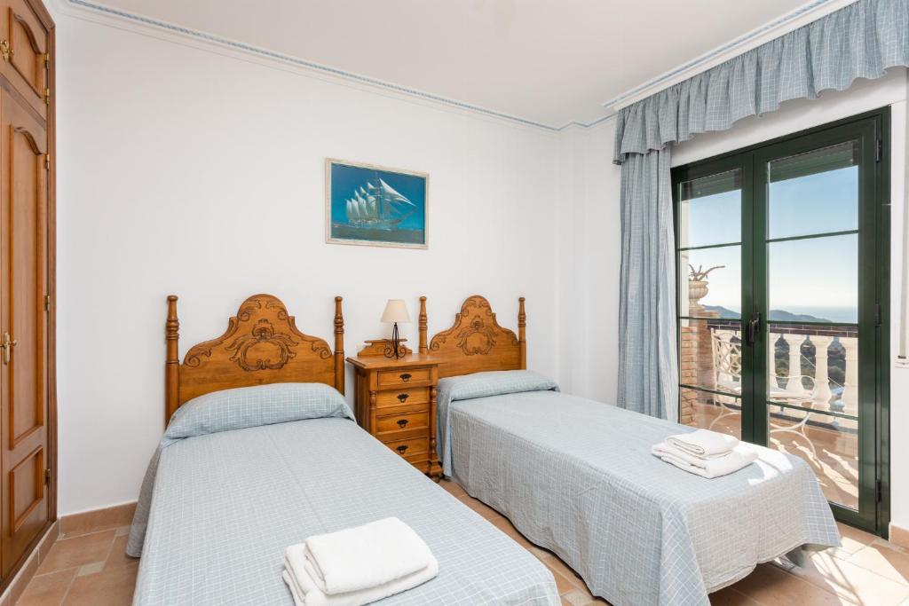 Postel nebo postele na pokoji v ubytování Villa El Pedregal