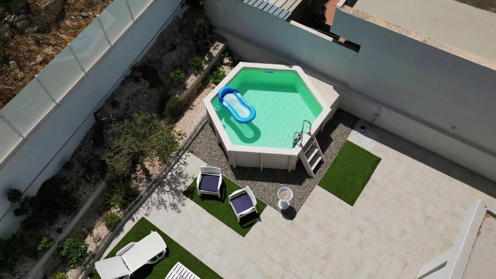 an overhead view of a swimming pool on a building at villa Dantès in Bari