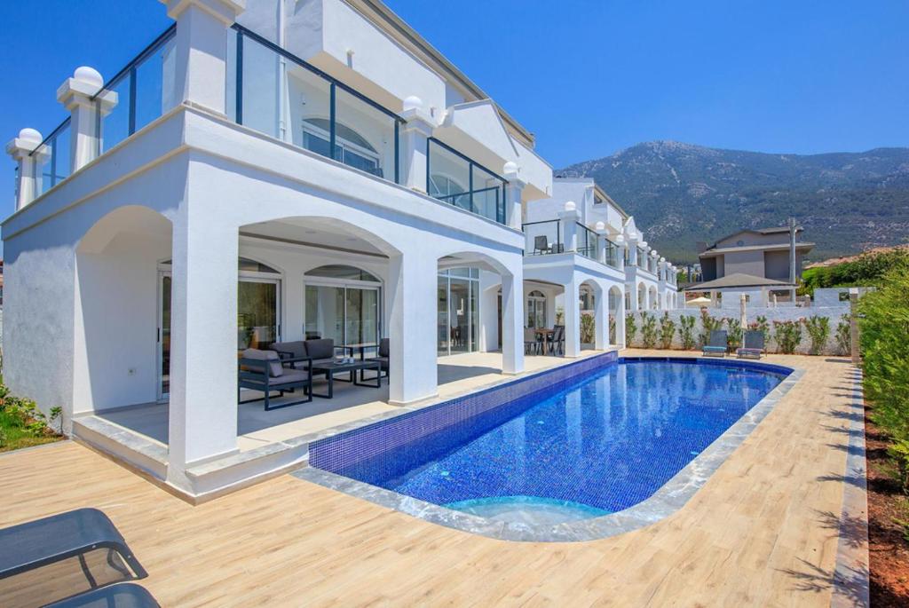 an image of a house with a swimming pool at Orka World Villa 2 in Oludeniz