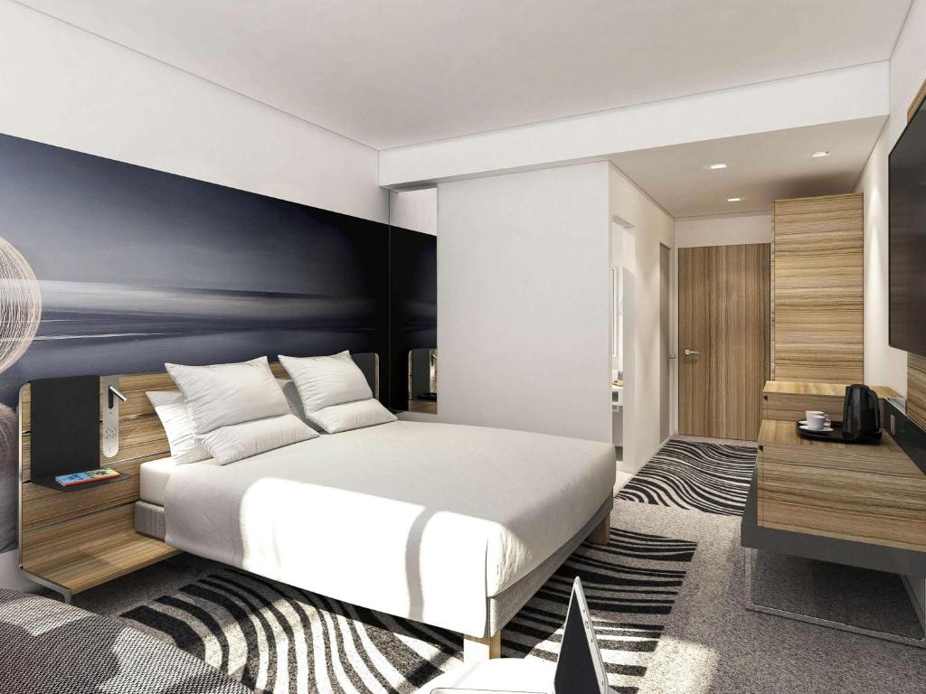 TV a/nebo společenská místnost v ubytování Hotel Novotel Brussels Off Grand Place