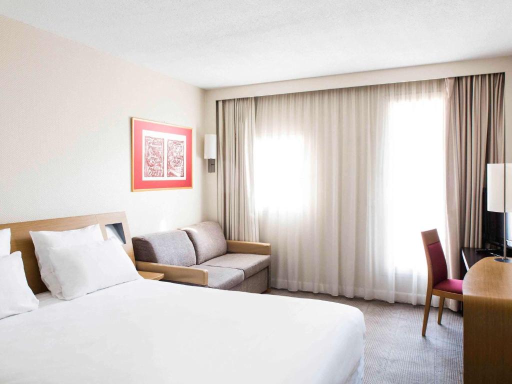 Postel nebo postele na pokoji v ubytování Hotel Novotel Brussels Off Grand Place