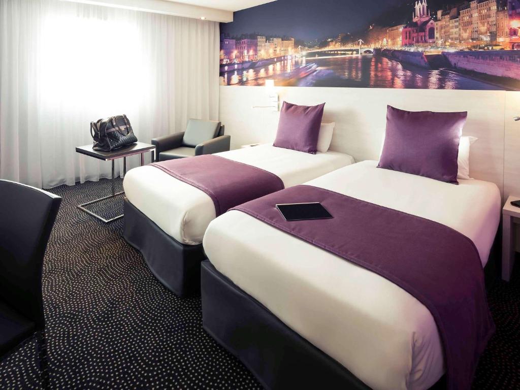 Postel nebo postele na pokoji v ubytování Hôtel Mercure Lyon Centre Charpennes Parc de la Tête d'Or