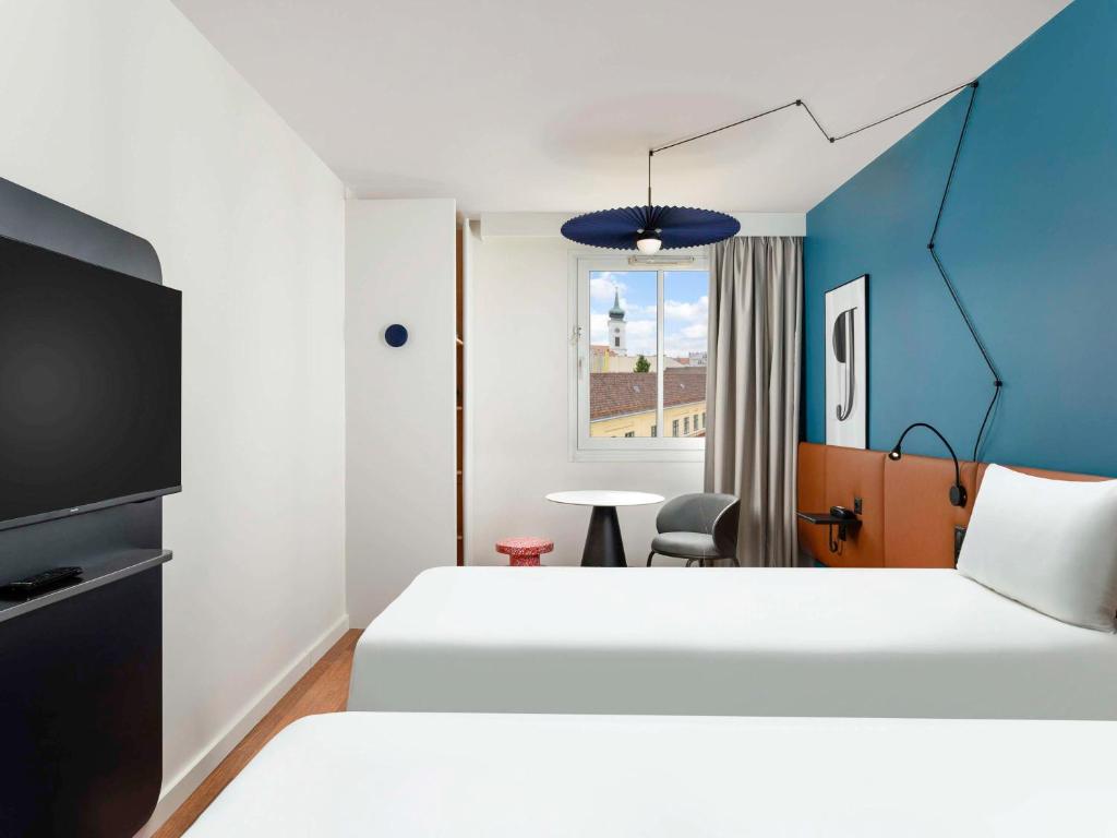 Postel nebo postele na pokoji v ubytování Ibis Budapest Centrum