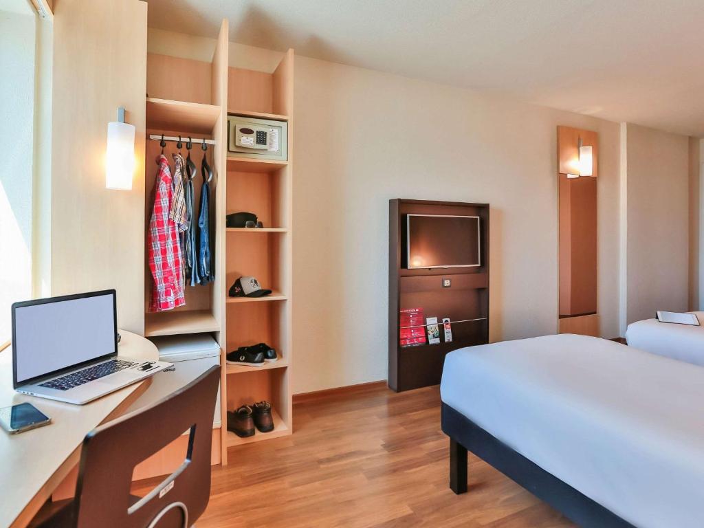 Cama ou camas em um quarto em ibis Sao Paulo Congonhas