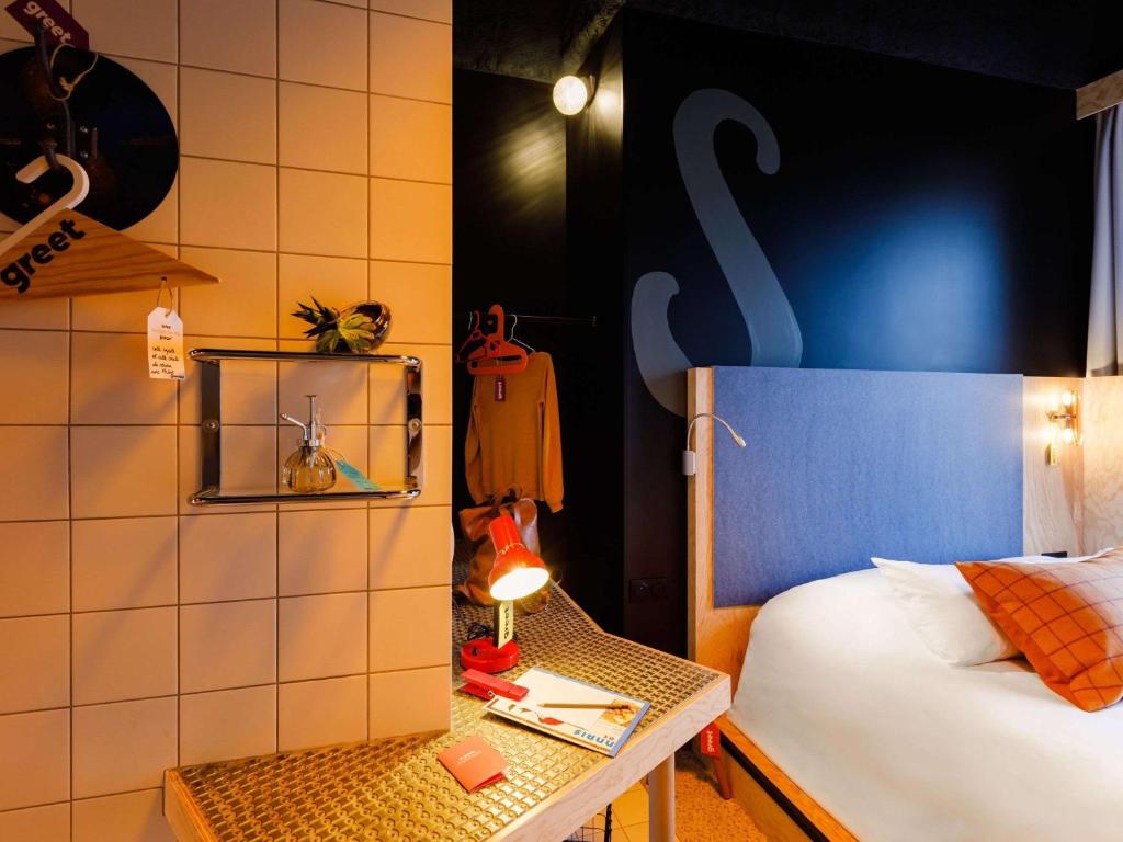 Postel nebo postele na pokoji v ubytování Greet Hotel Lyon Confluence
