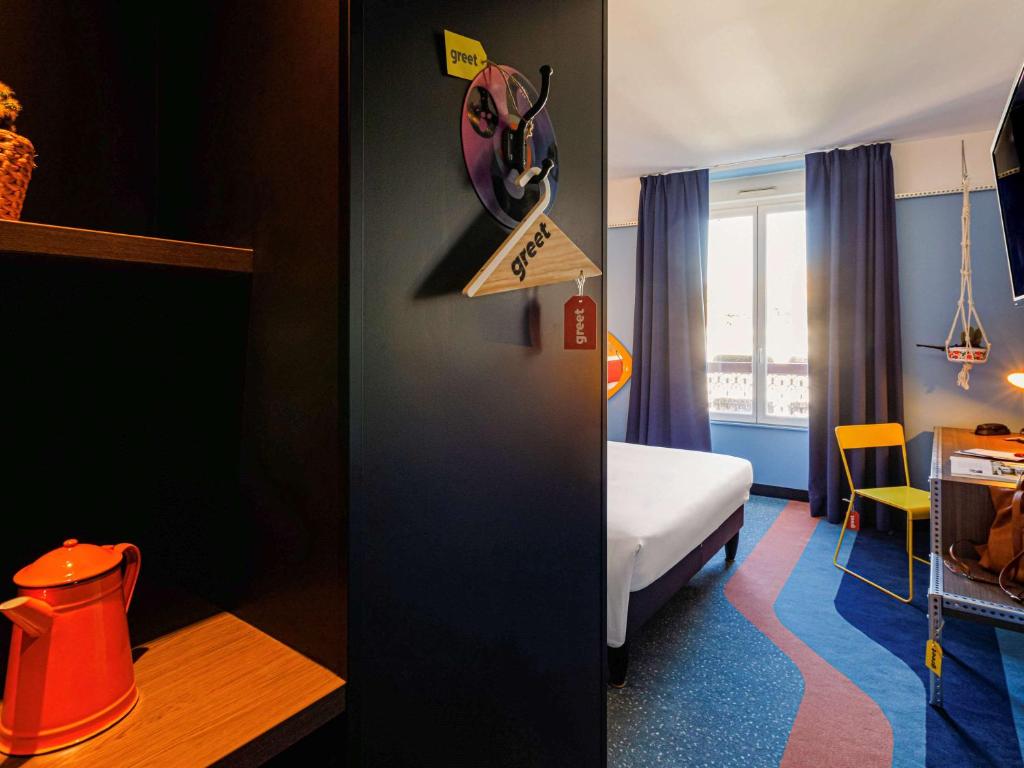 Postel nebo postele na pokoji v ubytování Greet Hotel Lyon Confluence
