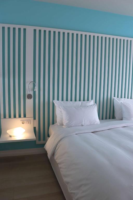 Postel nebo postele na pokoji v ubytování Radisson Blu Resort & Spa, Ajaccio Bay