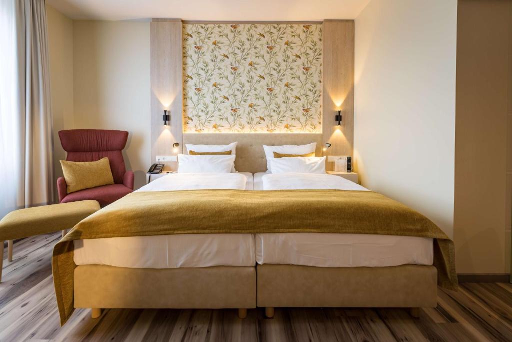 Postel nebo postele na pokoji v ubytování First Inn Hotel Zwickau