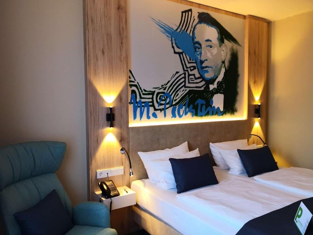 Postel nebo postele na pokoji v ubytování First Inn Hotel Zwickau
