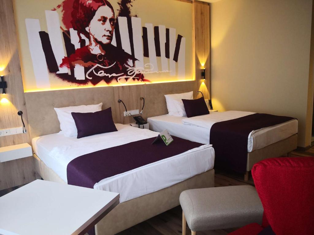 Postel nebo postele na pokoji v ubytování First Inn Hotel Zwickau