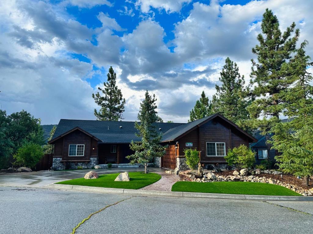 a house with a landscaping in front of it at CUSTOM SINGLE STORY CABIN WITH JACUZZI POOL TABLE & BIG GAME ROOM WITH ARCADE games in Big Bear Lake