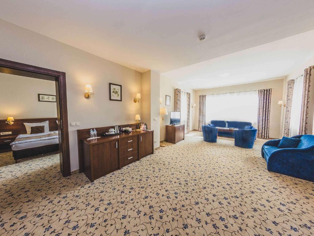 Postel nebo postele na pokoji v ubytování Dosłońce Resort Wellness & Farm
