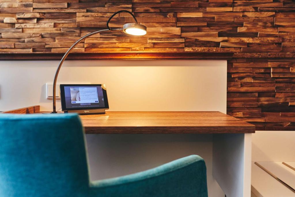 TV a/nebo společenská místnost v ubytování Dorint Strandresort & Spa Ostseebad Wustrow