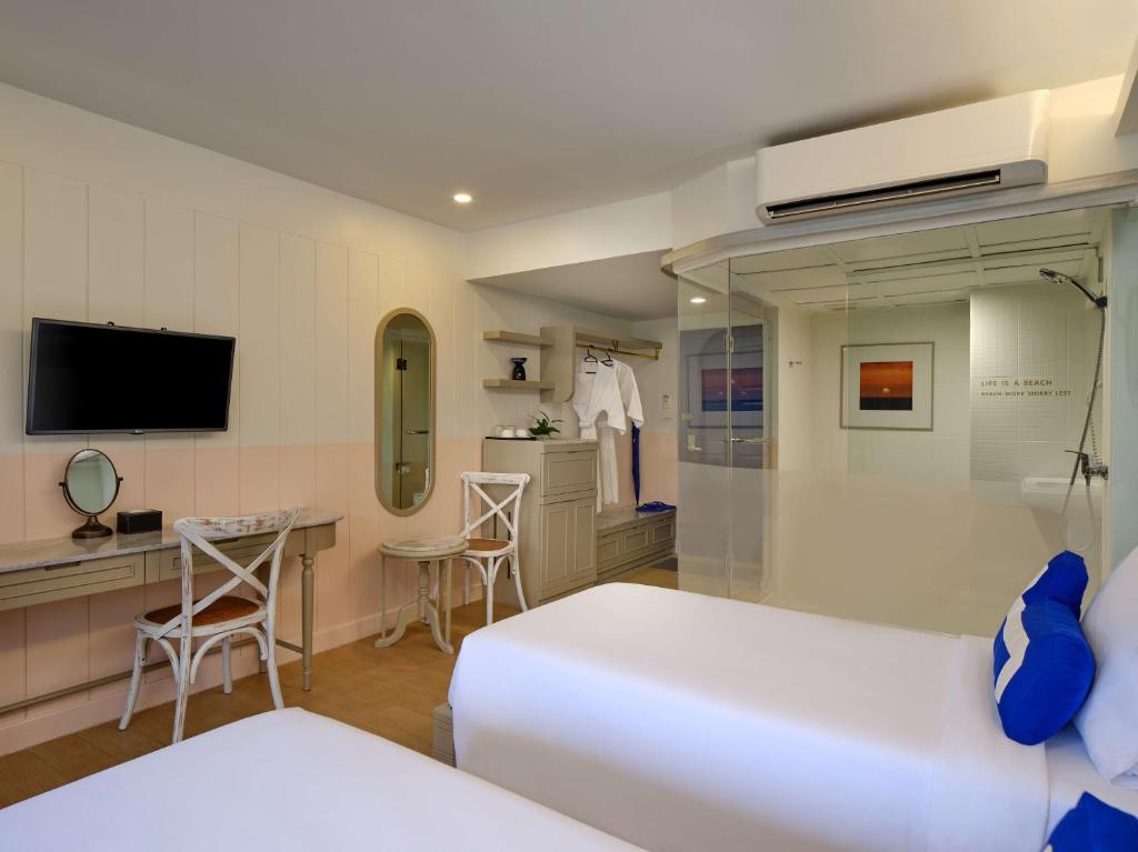 TV a/nebo společenská místnost v ubytování HOMM Bliss Southbeach Patong