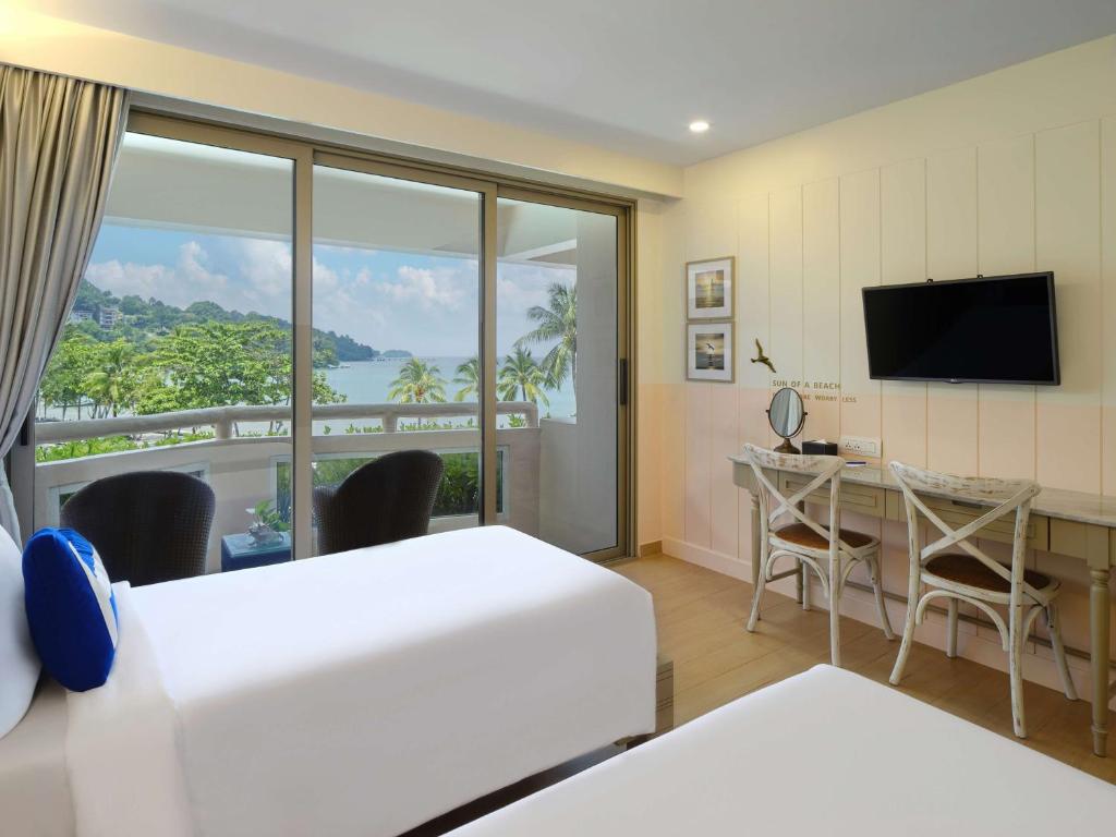 TV a/nebo společenská místnost v ubytování HOMM Bliss Southbeach Patong