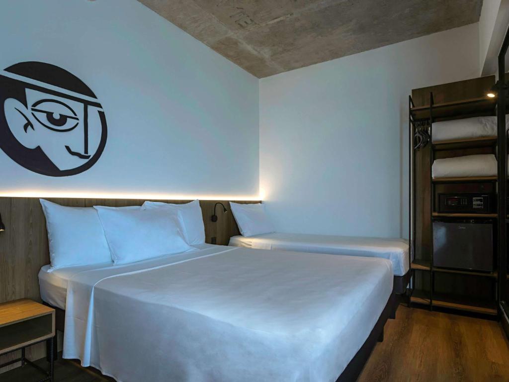 Postel nebo postele na pokoji v ubytování ibis Styles Maceió Pajuçara