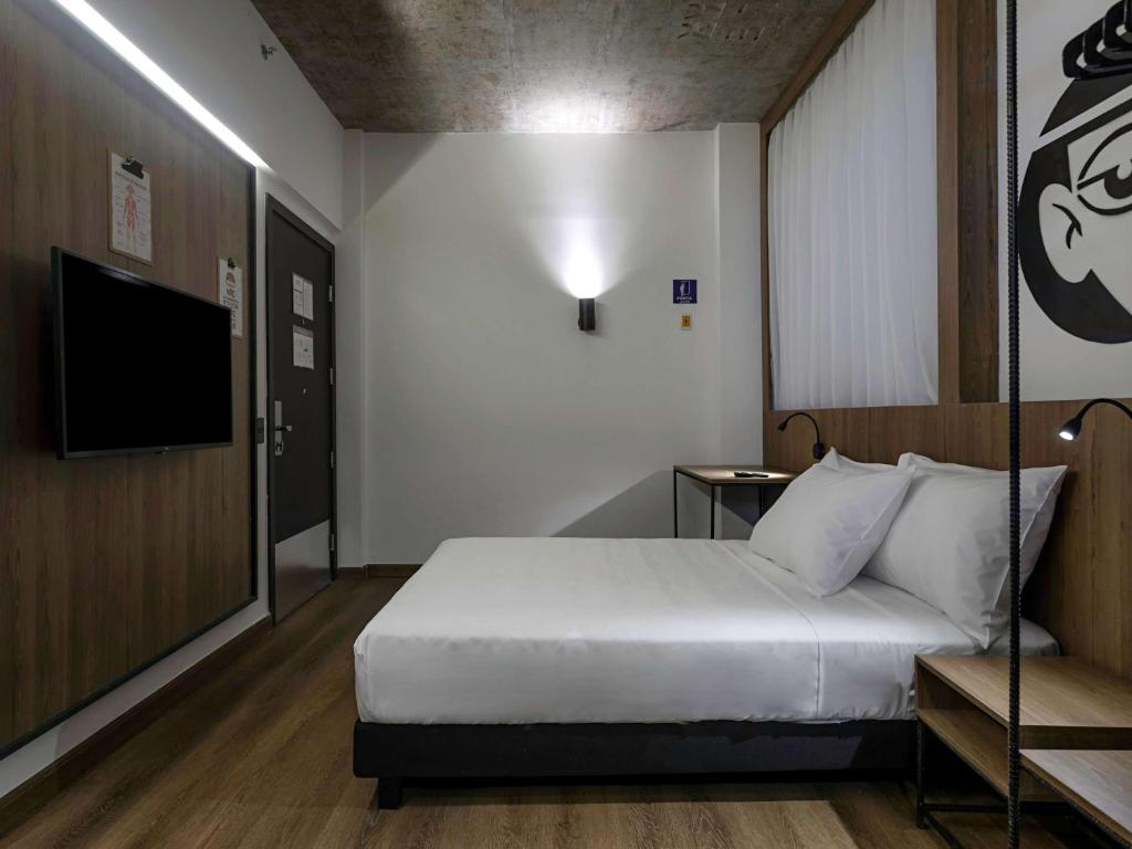 Postel nebo postele na pokoji v ubytování ibis Styles Maceió Pajuçara