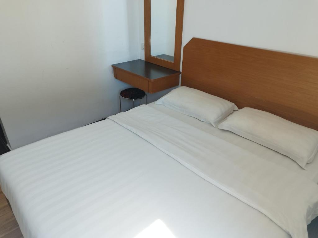 Postel nebo postele na pokoji v ubytování Marine Bay Hotel