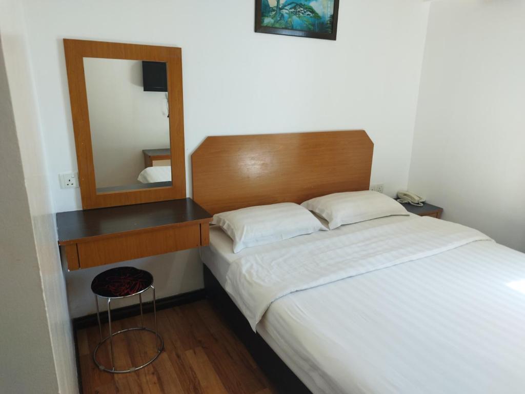 Postel nebo postele na pokoji v ubytování Marine Bay Hotel