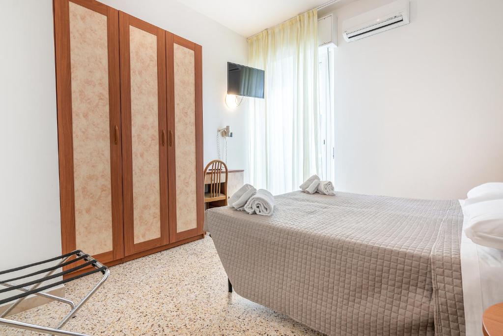 Postel nebo postele na pokoji v ubytování Hotel Lily