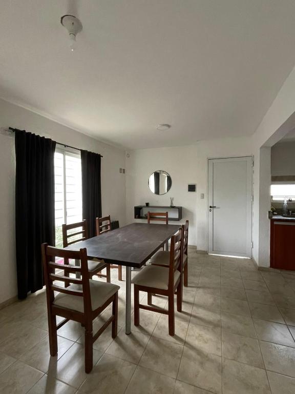 a dining room with a table and chairs at DUPLEX BV in Bell Ville