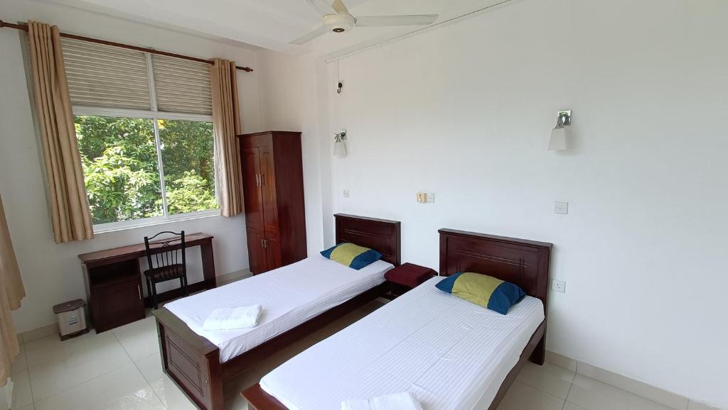 Postel nebo postele na pokoji v ubytování Smile Hub Kandy -Youth Hostel-