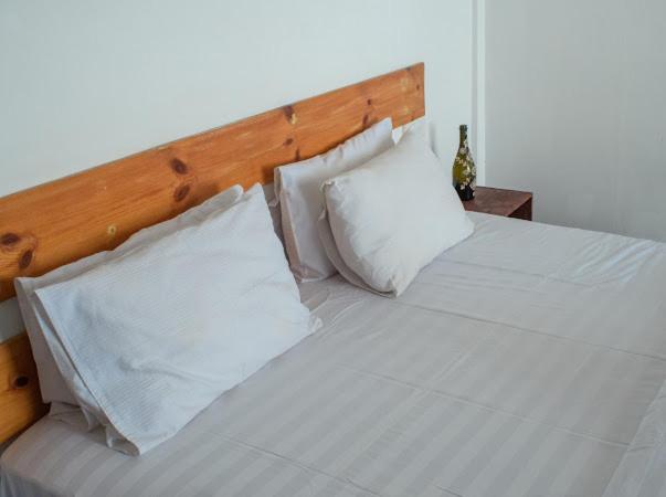 Postel nebo postele na pokoji v ubytování Elysian Hideaway