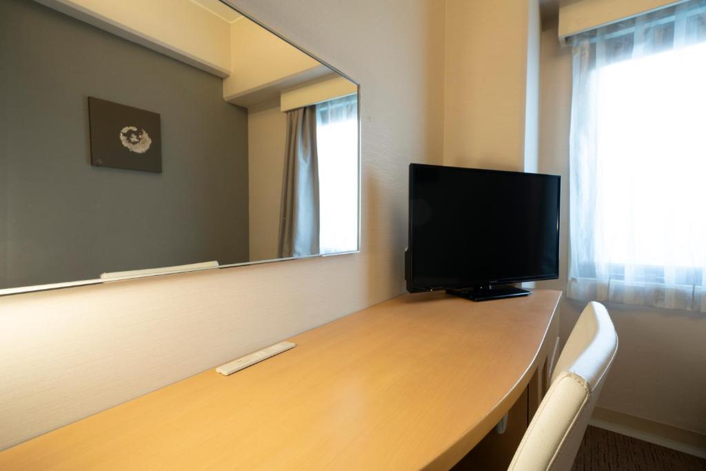 TV a/nebo společenská místnost v ubytování Hotel Binario Umeda
