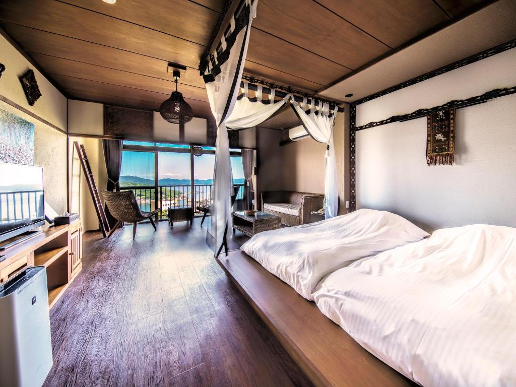 Postel nebo postele na pokoji v ubytování Bali Resort SAYA no Kaze