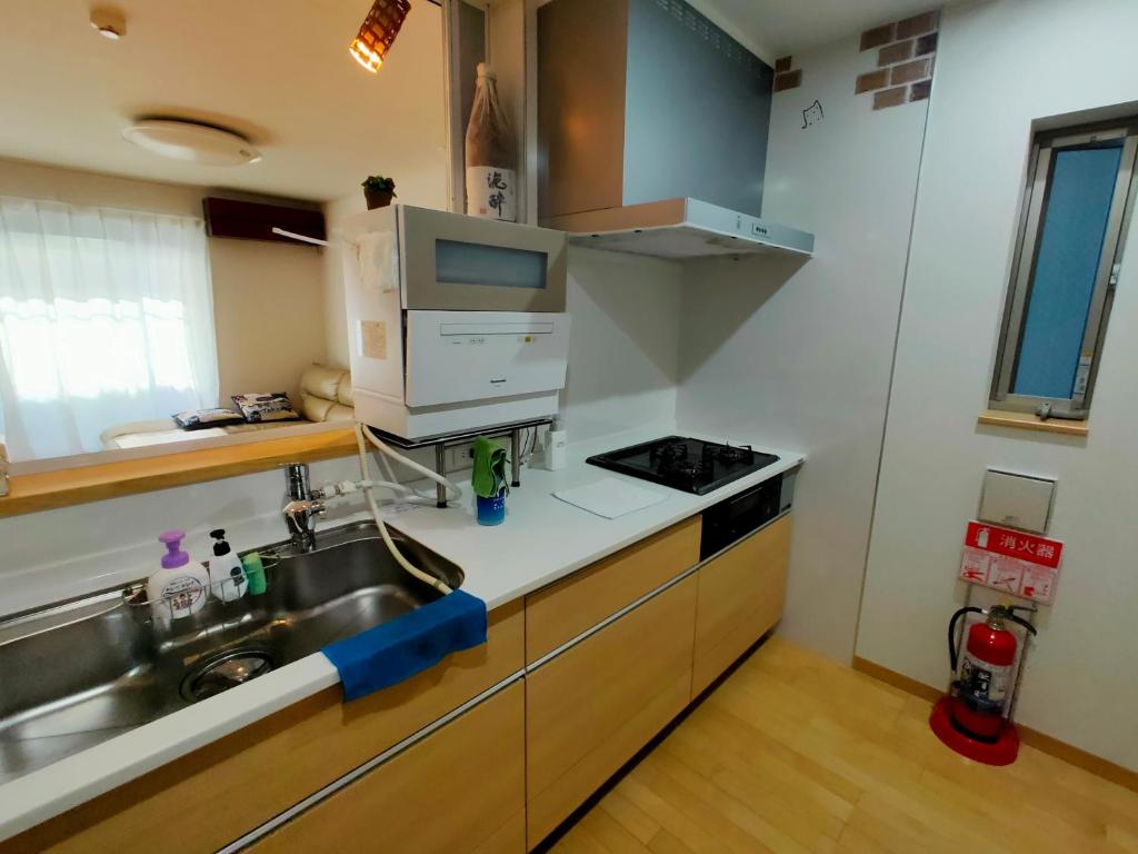 Kuchyň nebo kuchyňský kout v ubytování K.House