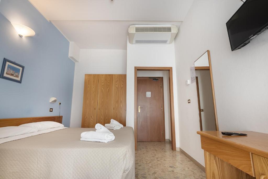 Postel nebo postele na pokoji v ubytování Hotel Santiago