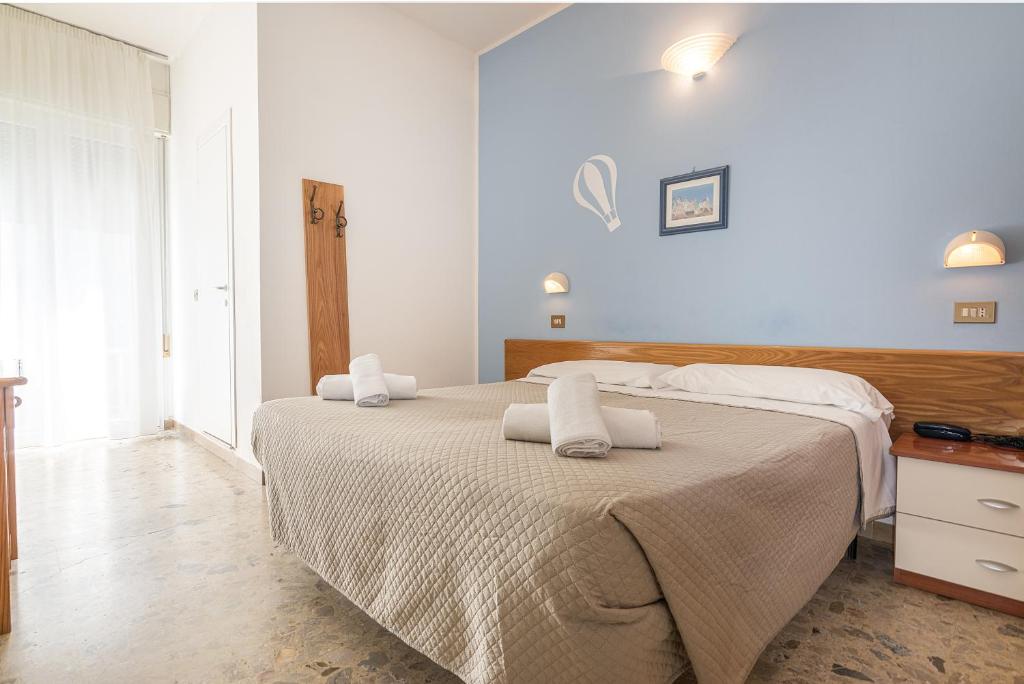 Postel nebo postele na pokoji v ubytování Hotel Santiago