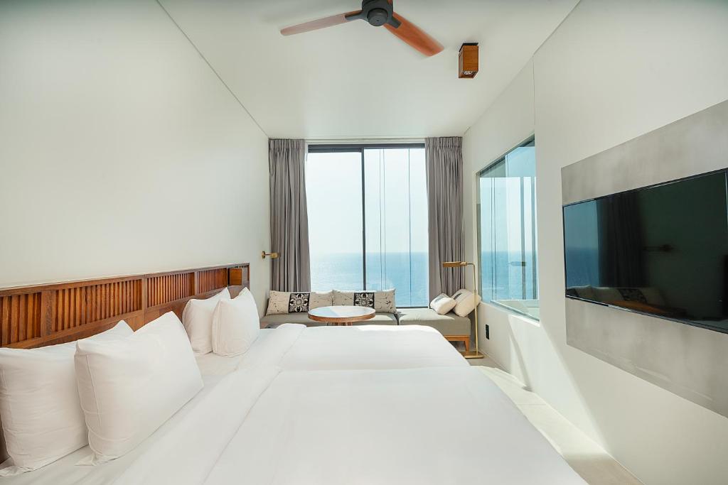 Postel nebo postele na pokoji v ubytování Granbell Hotel Colombo