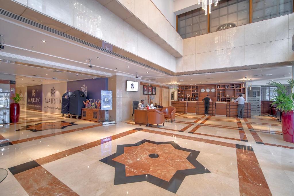 a large lobby with a star on the floor at Majestic Premier Hotel Burdubai in Dubai