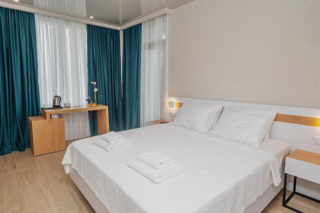 Voodi või voodid majutusasutuse Ritsa Resort toas
