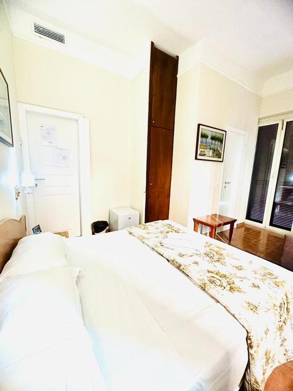 Postel nebo postele na pokoji v ubytování Hotel Resi