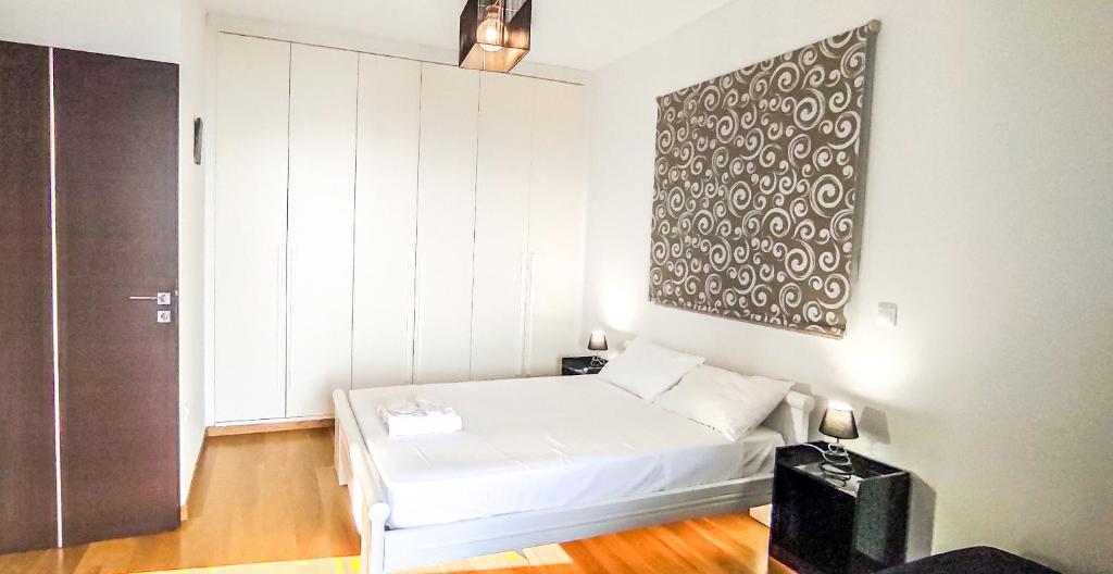 Кровать или кровати в номере Avatonblue Villa Nafplio