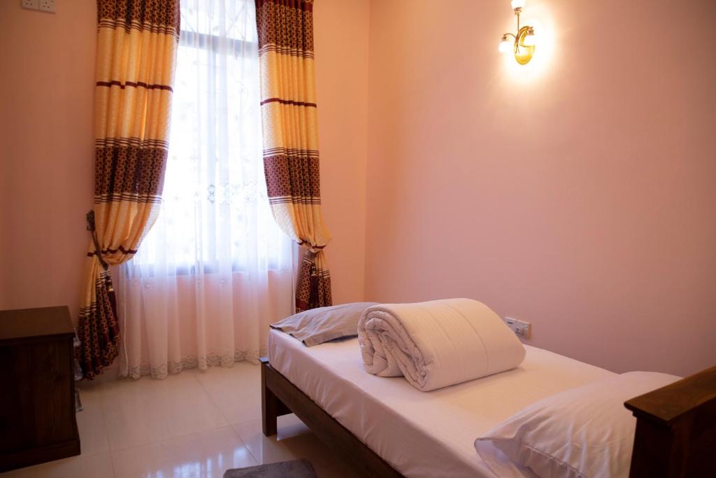 Postel nebo postele na pokoji v ubytování WIMAL PALACE