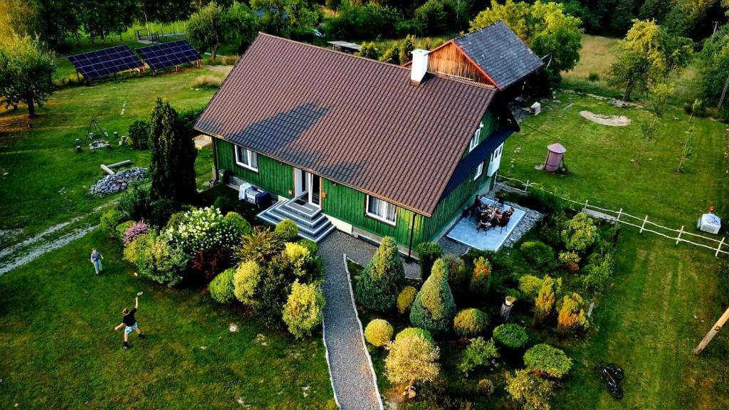 an overhead view of a house with a red roof at Zielony Zakątek Ciężkowice in Ciężkowice