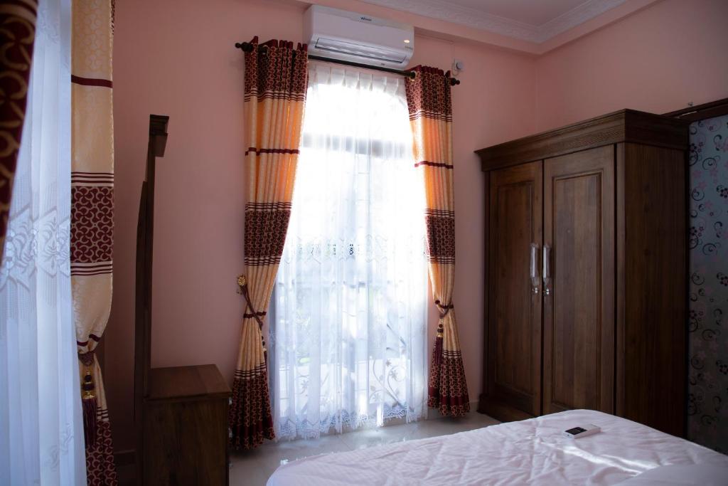 Postel nebo postele na pokoji v ubytování WIMAL PALACE