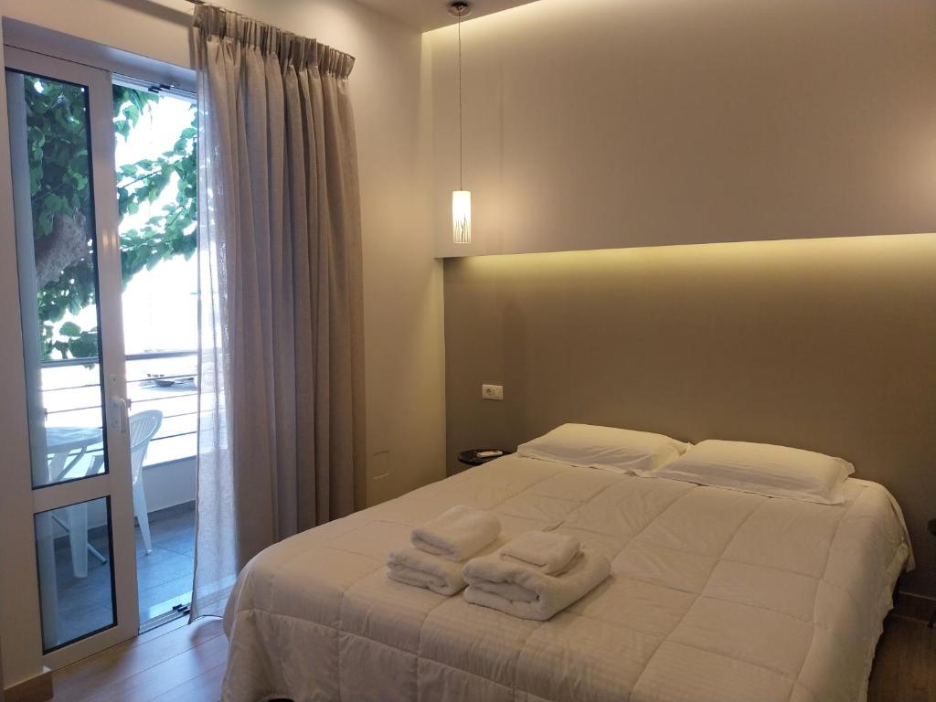 A bed or beds in a room at ERODIOS TOWN