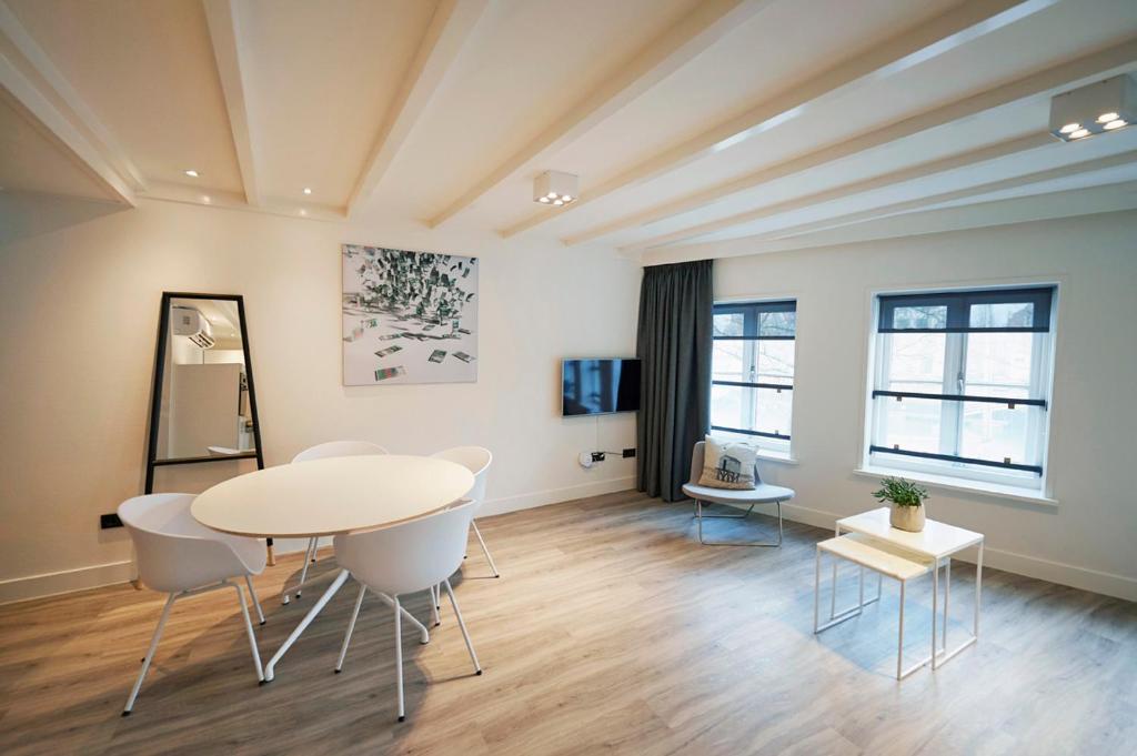 TV a/nebo společenská místnost v ubytování "DE BANK" - Hotel Apartments