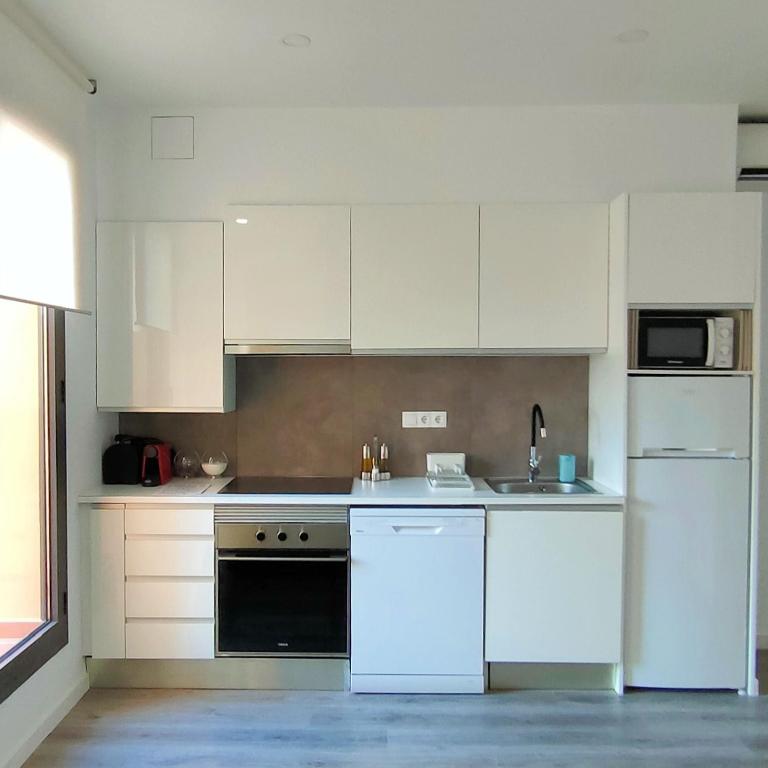 Kuchyň nebo kuchyňský kout v ubytování Mediterranean Barcelona Apartments