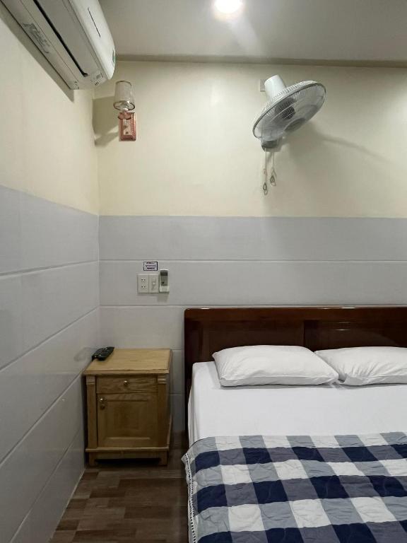 Postel nebo postele na pokoji v ubytování Căn hộ Tường Mơ (An Tâm Hotel)