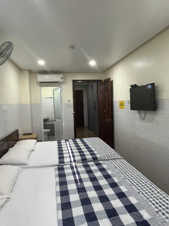 Postel nebo postele na pokoji v ubytování Căn hộ Tường Mơ (An Tâm Hotel)