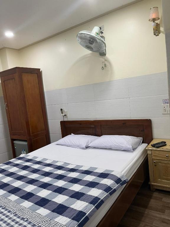 Postel nebo postele na pokoji v ubytování Căn hộ Tường Mơ (An Tâm Hotel)